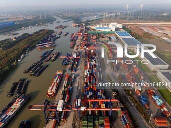 In Huai'an, China, on October 8, 2024, a photo shows transport ships in the port, dock, and river of the Beijing-Hangzhou Grand Canal in Hua...