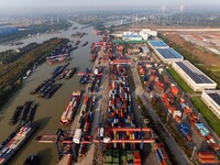 In Huai'an, China, on October 8, 2024, a photo shows transport ships in the port, dock, and river of the Beijing-Hangzhou Grand Canal in Hua...