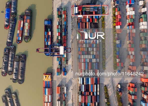 In Huai'an, China, on October 8, 2024, a photo shows transport ships in the port, dock, and river of the Beijing-Hangzhou Grand Canal in Hua...