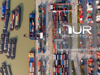 In Huai'an, China, on October 8, 2024, a photo shows transport ships in the port, dock, and river of the Beijing-Hangzhou Grand Canal in Hua...