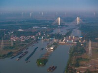 In Huai'an, China, on October 8, 2024, a photo shows transport ships in the port, dock, and river of the Beijing-Hangzhou Grand Canal in Hua...