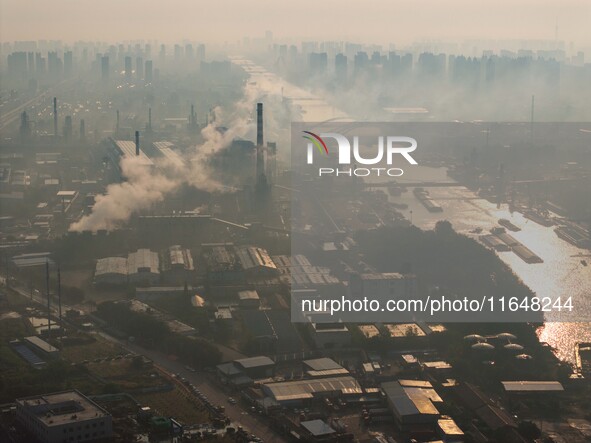 In Huai'an, China, on October 8, 2024, a photo shows transport ships in the port, dock, and river of the Beijing-Hangzhou Grand Canal in Hua...