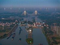 In Huai'an, China, on October 8, 2024, a photo shows transport ships in the port, dock, and river of the Beijing-Hangzhou Grand Canal in Hua...