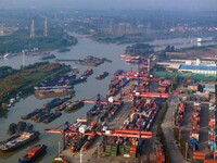 In Huai'an, China, on October 8, 2024, a photo shows transport ships in the port, dock, and river of the Beijing-Hangzhou Grand Canal in Hua...