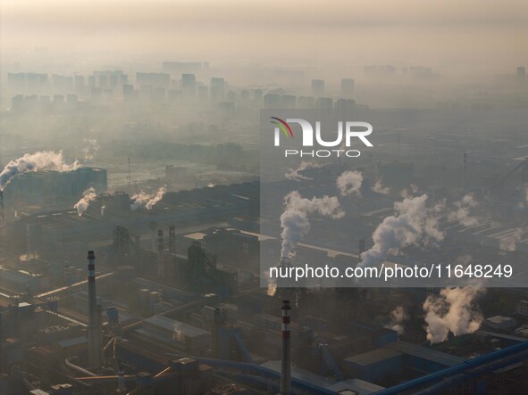 In Huai'an, China, on October 8, 2024, a photo shows transport ships in the port, dock, and river of the Beijing-Hangzhou Grand Canal in Hua...