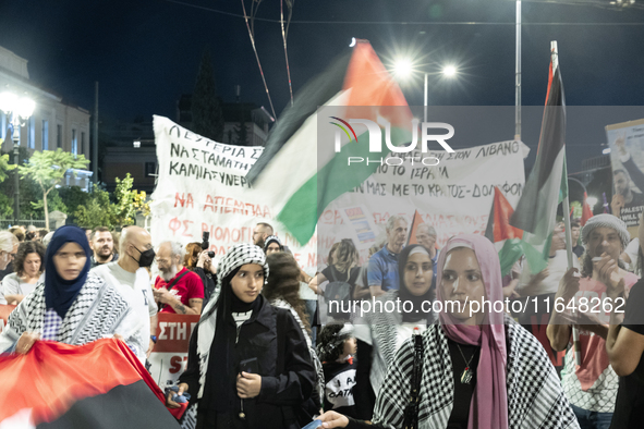 Hundreds of pro-Palestinian demonstrators march on the Israeli embassy in Athens, Greece, on October 7, 2024. 