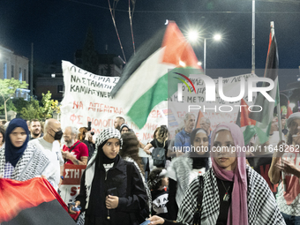 Hundreds of pro-Palestinian demonstrators march on the Israeli embassy in Athens, Greece, on October 7, 2024. (