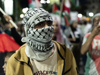 Hundreds of pro-Palestinian demonstrators march on the Israeli embassy in Athens, Greece, on October 7, 2024. (