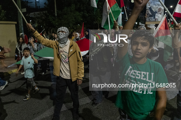 Hundreds of pro-Palestinian demonstrators march on the Israeli embassy in Athens, Greece, on October 7, 2024. 