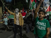 Hundreds of pro-Palestinian demonstrators march on the Israeli embassy in Athens, Greece, on October 7, 2024. (