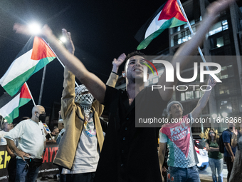 Hundreds of pro-Palestinian demonstrators march on the Israeli embassy in Athens, Greece, on October 7, 2024. (