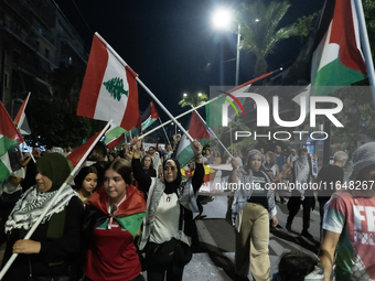 Hundreds of pro-Palestinian demonstrators march on the Israeli embassy in Athens, Greece, on October 7, 2024. (