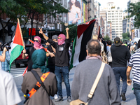 Pro-Palestinian protesters commemorate the anniversary of the October 7, 2023, Hamas attack on Israel in New York City, USA, on October 7, 2...