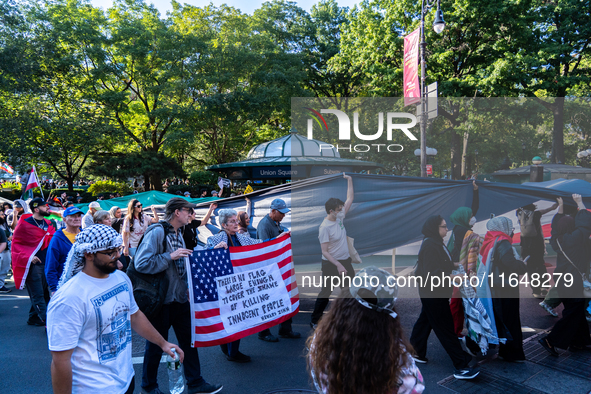 Pro-Palestinian protesters commemorate the anniversary of the October 7, 2023, Hamas attack on Israel in New York City, USA, on October 7, 2...