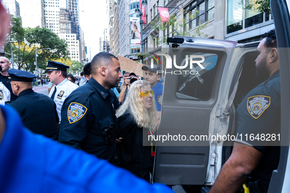 A pro-Palestinian protester is arrested during a protest commemorating the anniversary of the October 7, 2023, Hamas attack on Israel in New...