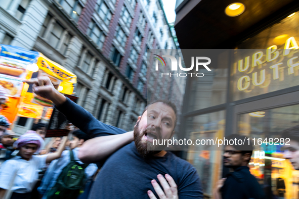 Clashes break out as pro-Palestinian protesters commemorate the anniversary of the October 7, 2023, Hamas attack on Israel in New York City,...