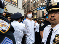 A pro-Palestinian protester is arrested during a protest commemorating the anniversary of the October 7, 2023, Hamas attack on Israel in New...