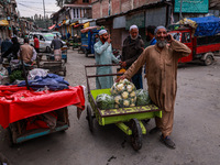 Kashmiri people talk early in the morning on the day of Assembly election results in Baramulla, Jammu and Kashmir, India, on October 8, 2024...