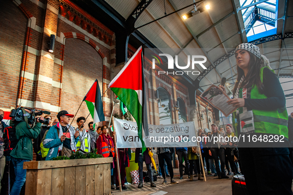 On October 7, 2024, in Nijmegen, Netherlands, hundreds of people gather at the main hall of the central train station to demand a ceasefire...