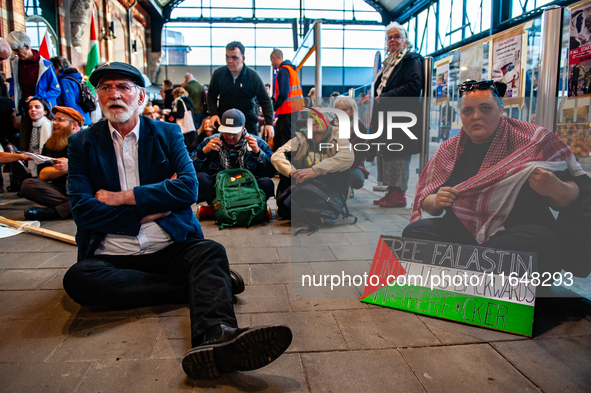 On October 7, 2024, in Nijmegen, Netherlands, hundreds of people gather at the main hall of the central train station to demand a ceasefire...