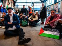 On October 7, 2024, in Nijmegen, Netherlands, hundreds of people gather at the main hall of the central train station to demand a ceasefire...