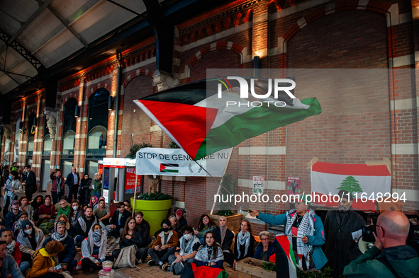 On October 7, 2024, in Nijmegen, Netherlands, hundreds of people gather at the main hall of the central train station to demand a ceasefire...