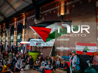 On October 7, 2024, in Nijmegen, Netherlands, hundreds of people gather at the main hall of the central train station to demand a ceasefire...