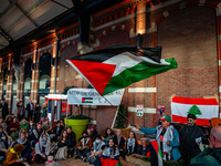 On October 7, 2024, in Nijmegen, Netherlands, hundreds of people gather at the main hall of the central train station to demand a ceasefire...