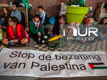 On October 7, 2024, in Nijmegen, Netherlands, hundreds of people gather at the main hall of the central train station to demand a ceasefire...