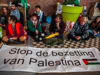 On October 7, 2024, in Nijmegen, Netherlands, hundreds of people gather at the main hall of the central train station to demand a ceasefire...