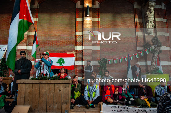 On October 7, 2024, in Nijmegen, Netherlands, hundreds of people gather at the main hall of the central train station to demand a ceasefire...