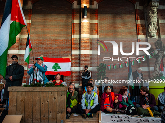 On October 7, 2024, in Nijmegen, Netherlands, hundreds of people gather at the main hall of the central train station to demand a ceasefire...