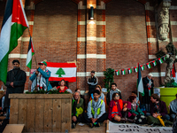 On October 7, 2024, in Nijmegen, Netherlands, hundreds of people gather at the main hall of the central train station to demand a ceasefire...