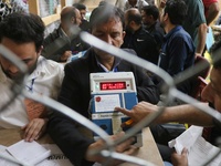 Election officials count votes for the local assembly elections at a counting center in Srinagar, Jammu and Kashmir, on October 8, 2024. (