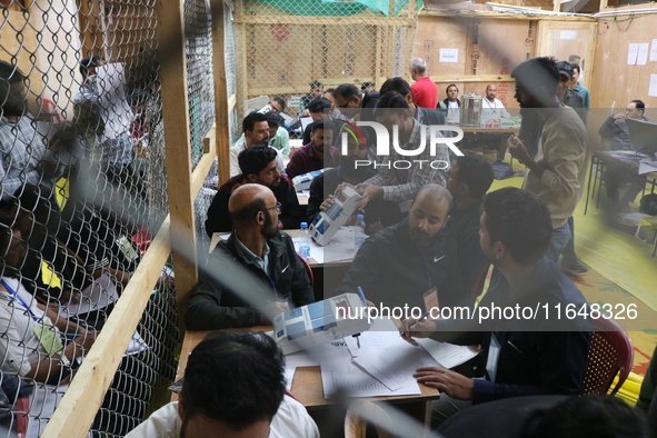 Election officials count votes for the local assembly elections at a counting center in Srinagar, Jammu and Kashmir, on October 8, 2024. 