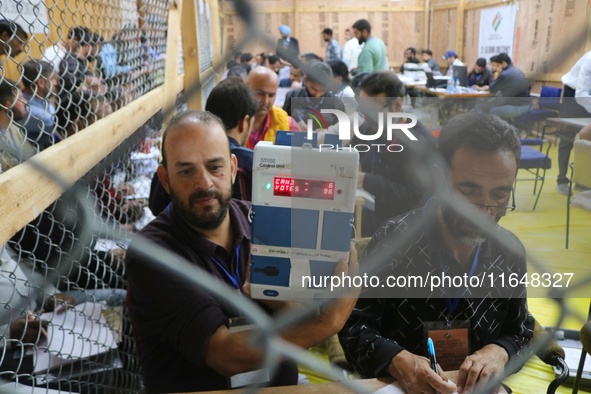 Election officials count votes for the local assembly elections at a counting center in Srinagar, Jammu and Kashmir, on October 8, 2024. 