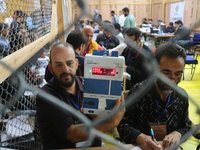 Election officials count votes for the local assembly elections at a counting center in Srinagar, Jammu and Kashmir, on October 8, 2024. (