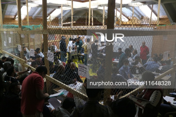 Election officials count votes for the local assembly elections at a counting center in Srinagar, Jammu and Kashmir, on October 8, 2024. 