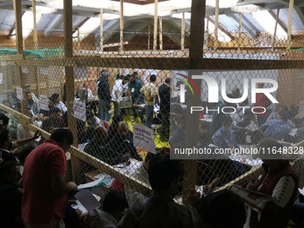 Election officials count votes for the local assembly elections at a counting center in Srinagar, Jammu and Kashmir, on October 8, 2024. (