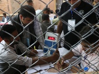 Election officials count votes for the local assembly elections at a counting center in Srinagar, Jammu and Kashmir, on October 8, 2024. (