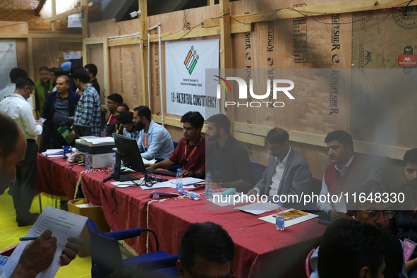 Election officials count votes for the local assembly elections at a counting center in Srinagar, Jammu and Kashmir, on October 8, 2024. 