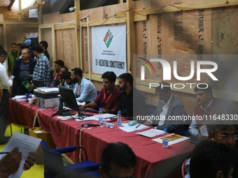 Election officials count votes for the local assembly elections at a counting center in Srinagar, Jammu and Kashmir, on October 8, 2024. (