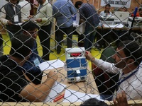 Election officials count votes for the local assembly elections at a counting center in Srinagar, Jammu and Kashmir, on October 8, 2024. (