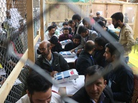 Election officials count votes for the local assembly elections at a counting center in Srinagar, Jammu and Kashmir, on October 8, 2024. (