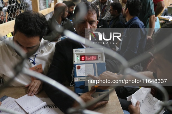 Election officials count votes for the local assembly elections at a counting center in Srinagar, Jammu and Kashmir, on October 8, 2024. 