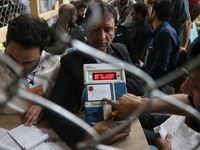 Election officials count votes for the local assembly elections at a counting center in Srinagar, Jammu and Kashmir, on October 8, 2024. (