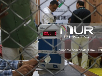 Election officials count votes for the local assembly elections at a counting center in Srinagar, Jammu and Kashmir, on October 8, 2024. (