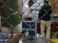 Election officials count votes for the local assembly elections at a counting center in Srinagar, Jammu and Kashmir, on October 8, 2024. (