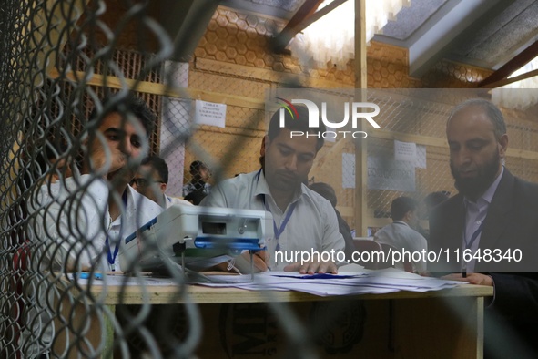 Election officials count votes for the local assembly elections at a counting center in Srinagar, Jammu and Kashmir, on October 8, 2024. 