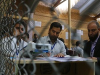 Election officials count votes for the local assembly elections at a counting center in Srinagar, Jammu and Kashmir, on October 8, 2024. (